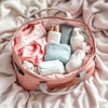 Stylish pregnancy bag filled with essential baby items.