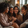 Diverse women supporting each other in a cozy setting.